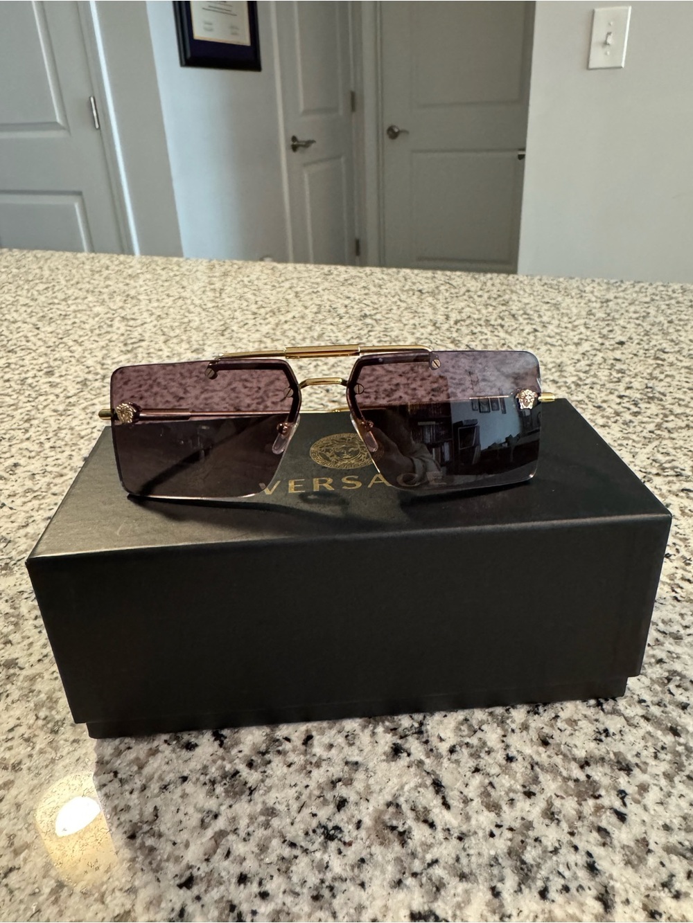 Versace Rimless Sunglasses with Purple-Tinted Lenses and Gold Temples